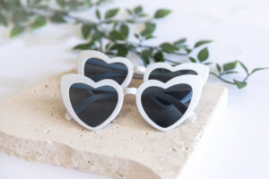 White wedding sunnies perfect for wedding photos and photo booths.